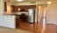 a kitchen with wooden cabinets